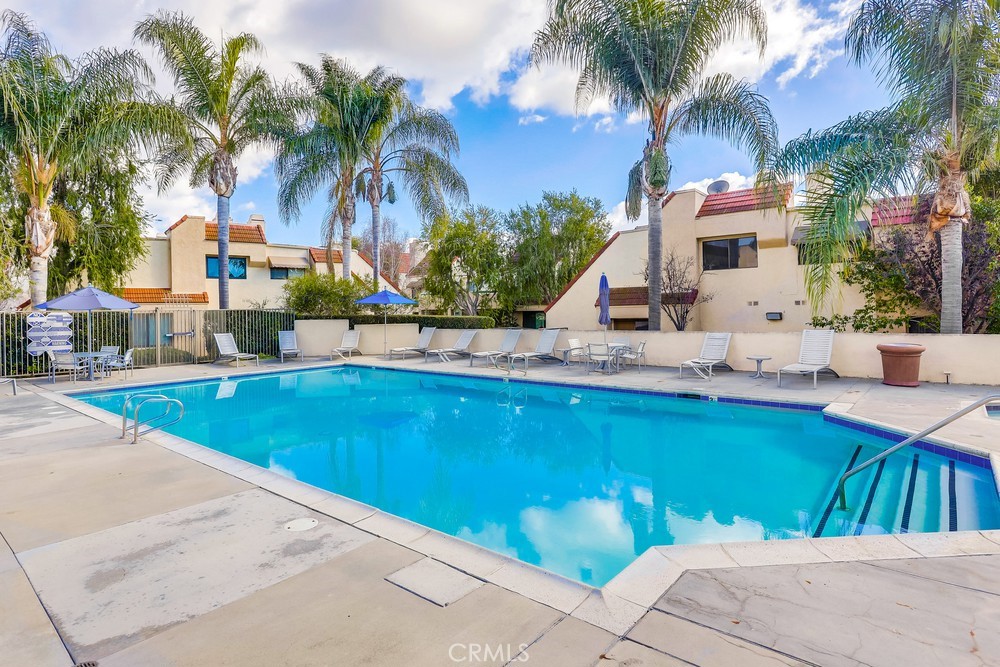 87 Grenada Street, Unit 174 Laguna Niguel, CA 92677 - Photo 17 of 17 a view of swimming pool with outdoor seating and house in the background