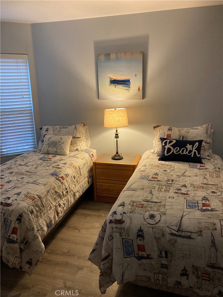 501 North Pacific Street, Unit 23 Oceanside, CA 92054 - Photo 13 of 24 a bedroom with a bed and a window