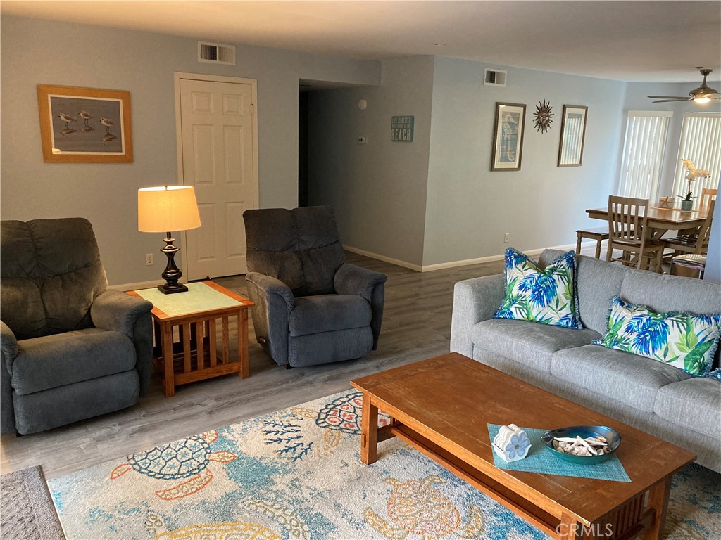 501 North Pacific Street, Unit 23 Oceanside, CA 92054 - Photo 3 of 24 a living room with furniture and a couch