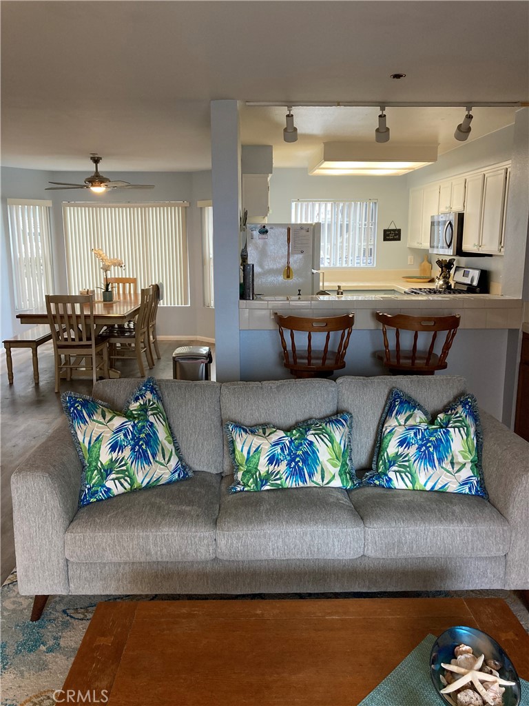 501 North Pacific Street, Unit 23 Oceanside, CA 92054 - Photo 4 of 24 a living room with furniture and a couch