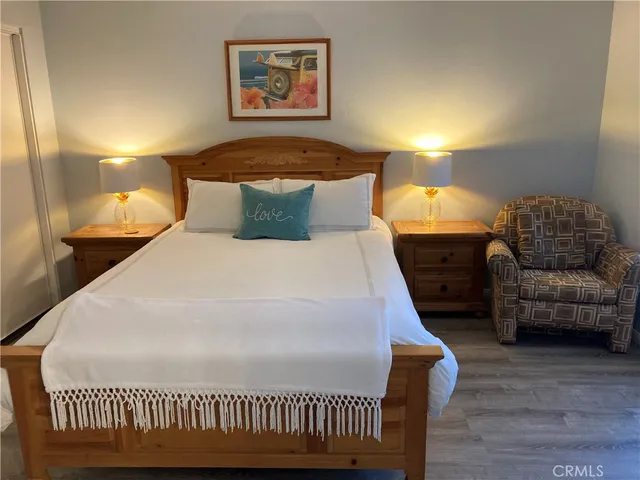 a bedroom with a bed and a couch