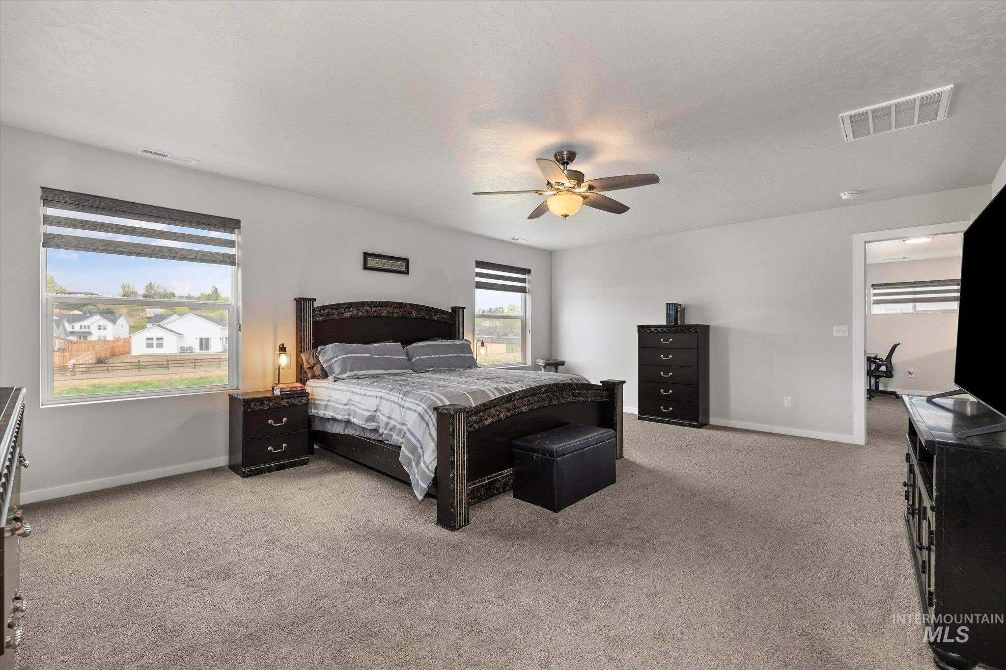 2024 Placerville Street Middleton, ID 83644 - Photo 19 of 38 Bedroom featuring light carpet and a ceiling fan