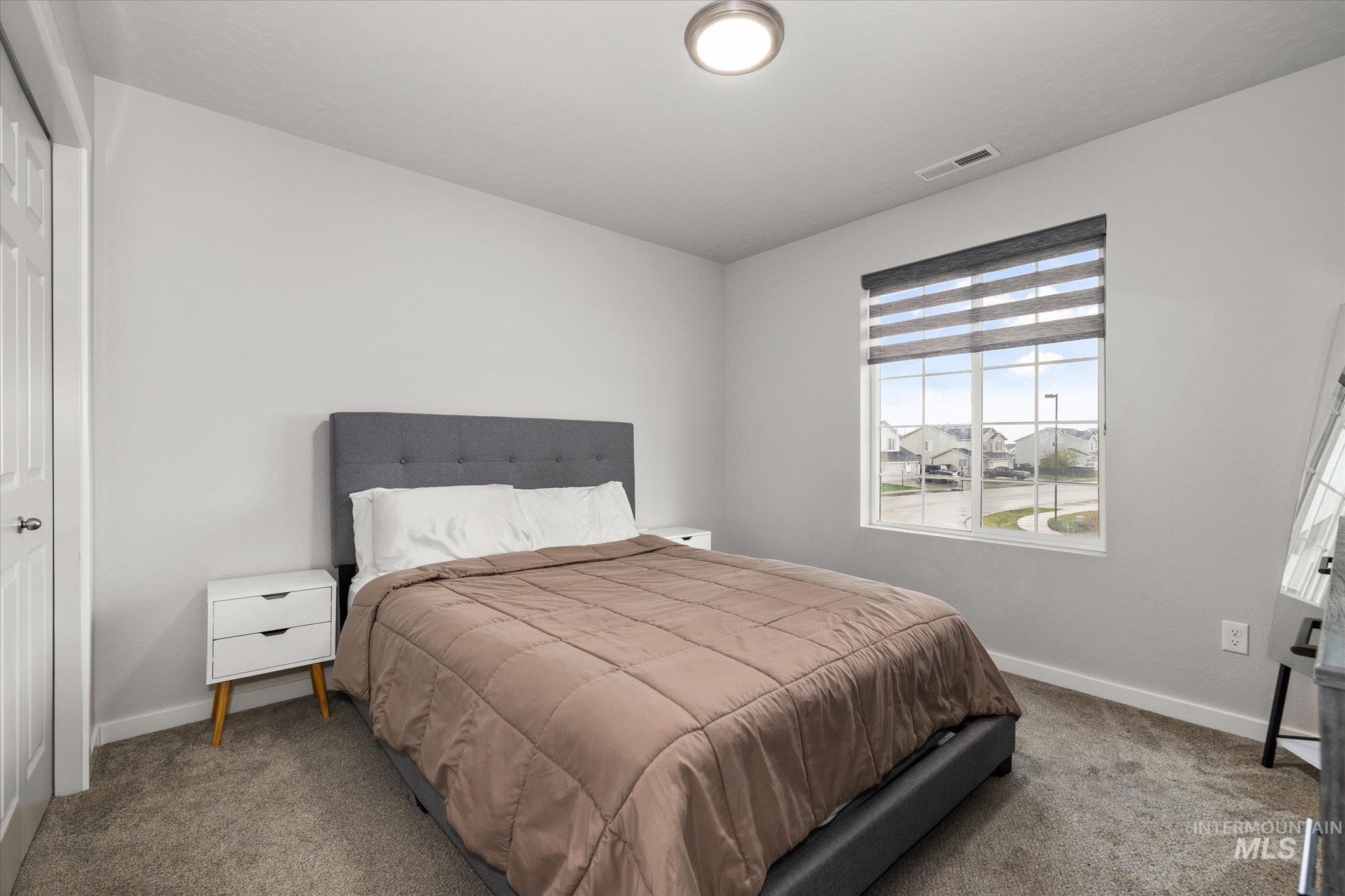 2024 Placerville Street Middleton, ID 83644 - Photo 30 of 38 Bedroom with carpet and a closet