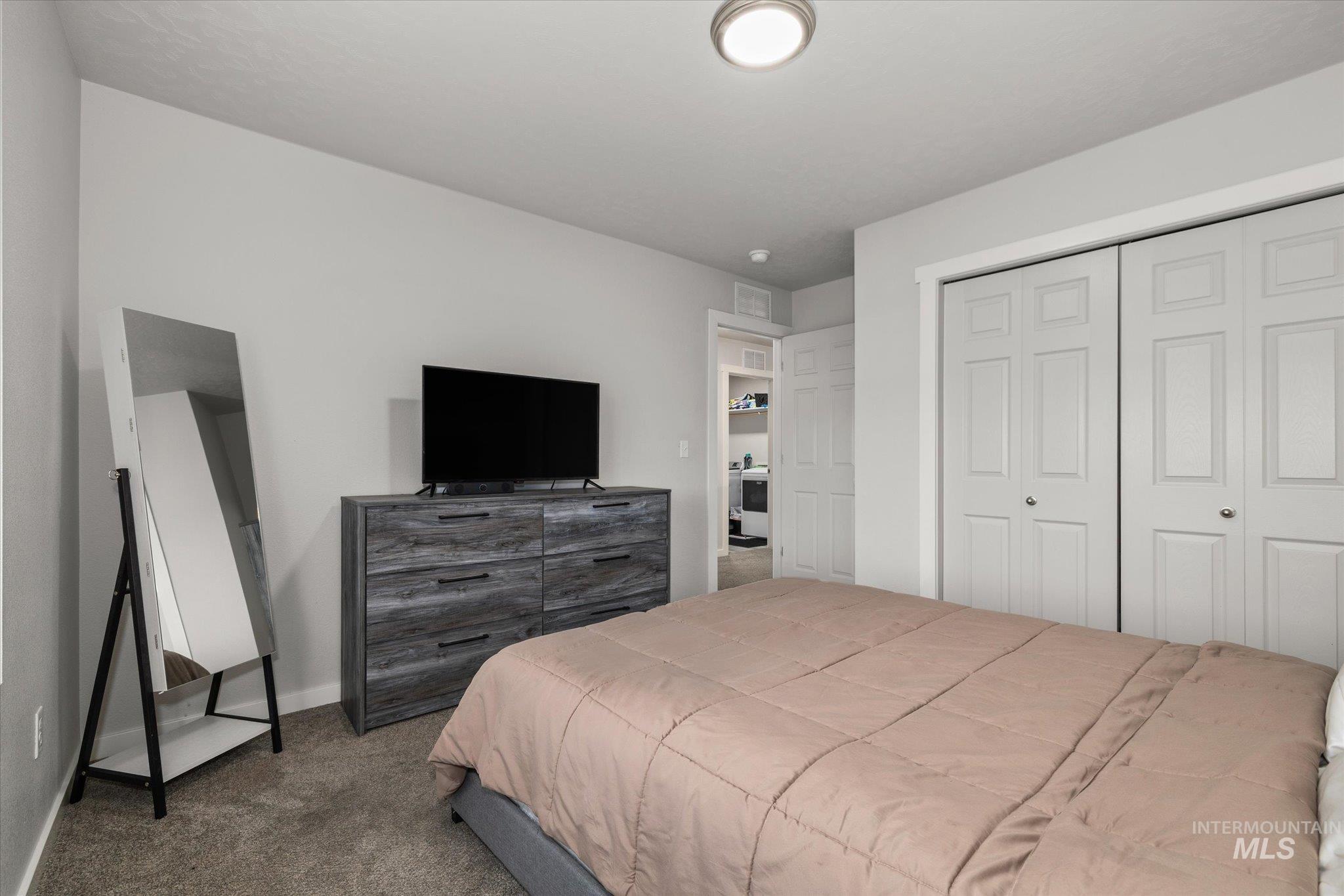 2024 Placerville Street Middleton, ID 83644 - Photo 31 of 38 Bedroom featuring dark carpet and a closet