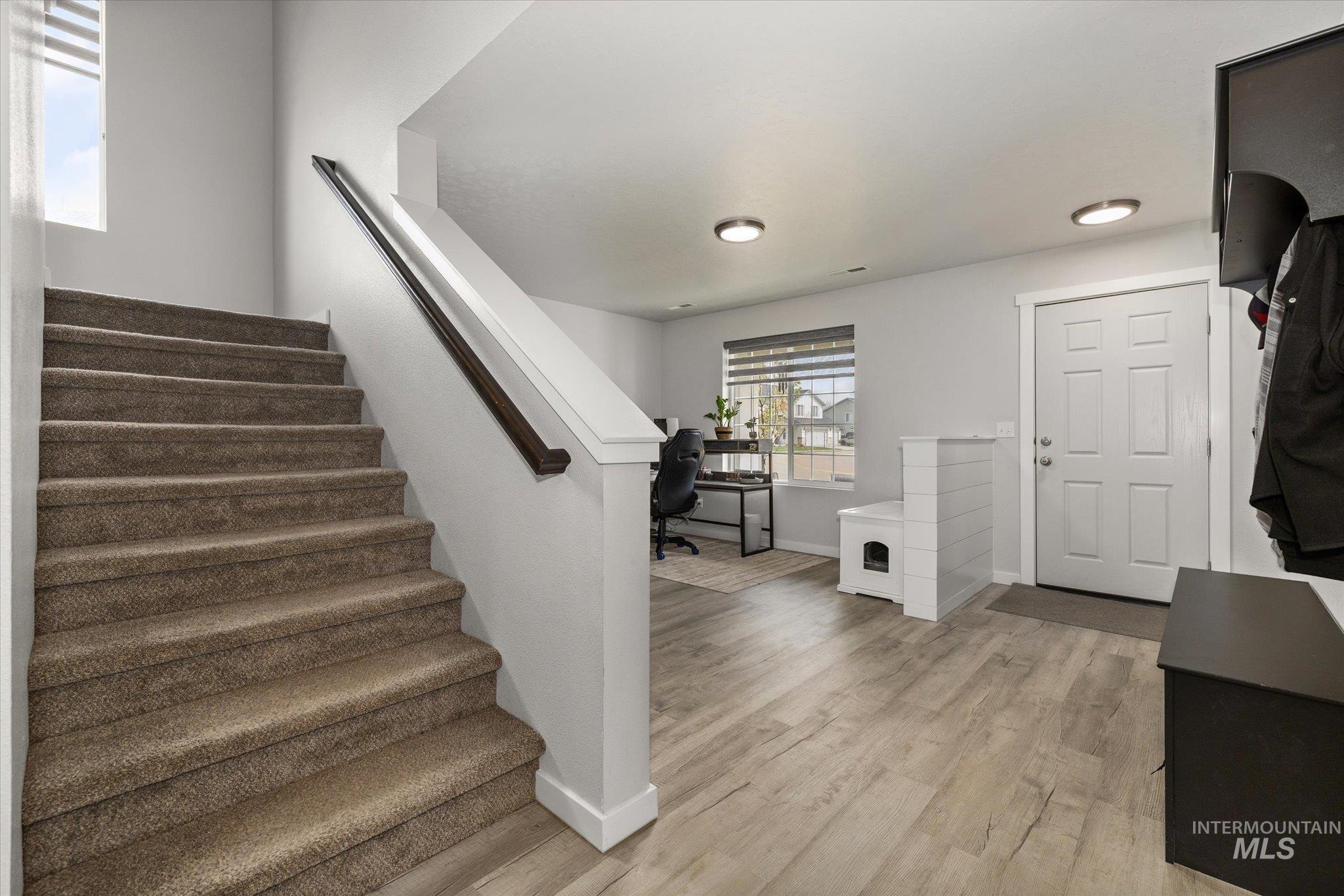 2024 Placerville Street Middleton, ID 83644 - Photo 10 of 38 Staircase featuring baseboards and wood finished floors