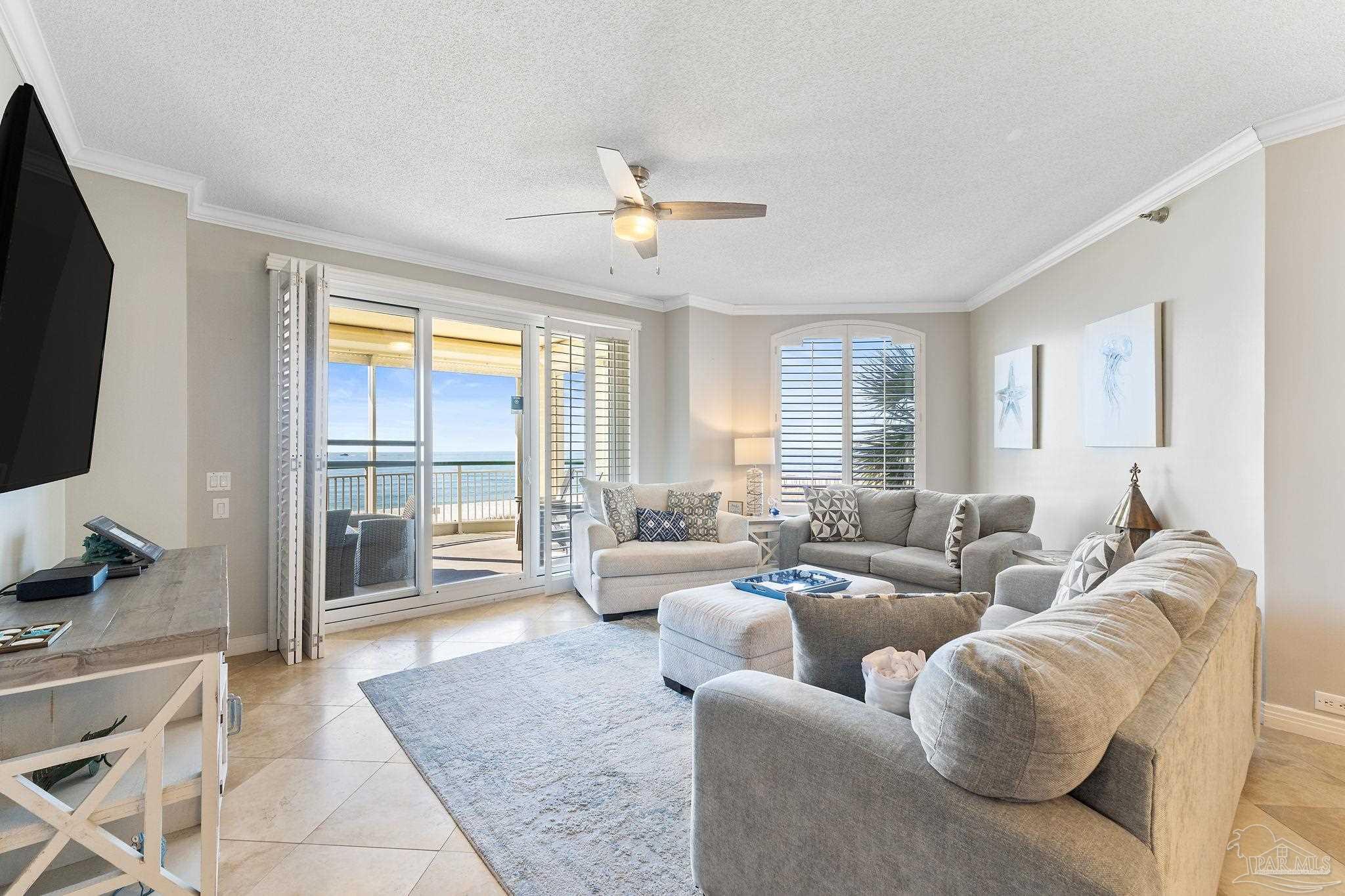 13601 Perdido Key Drive, Unit W2C Perdido Key, FL 32507 - Photo 11 of 63 a living room with furniture and a flat screen tv