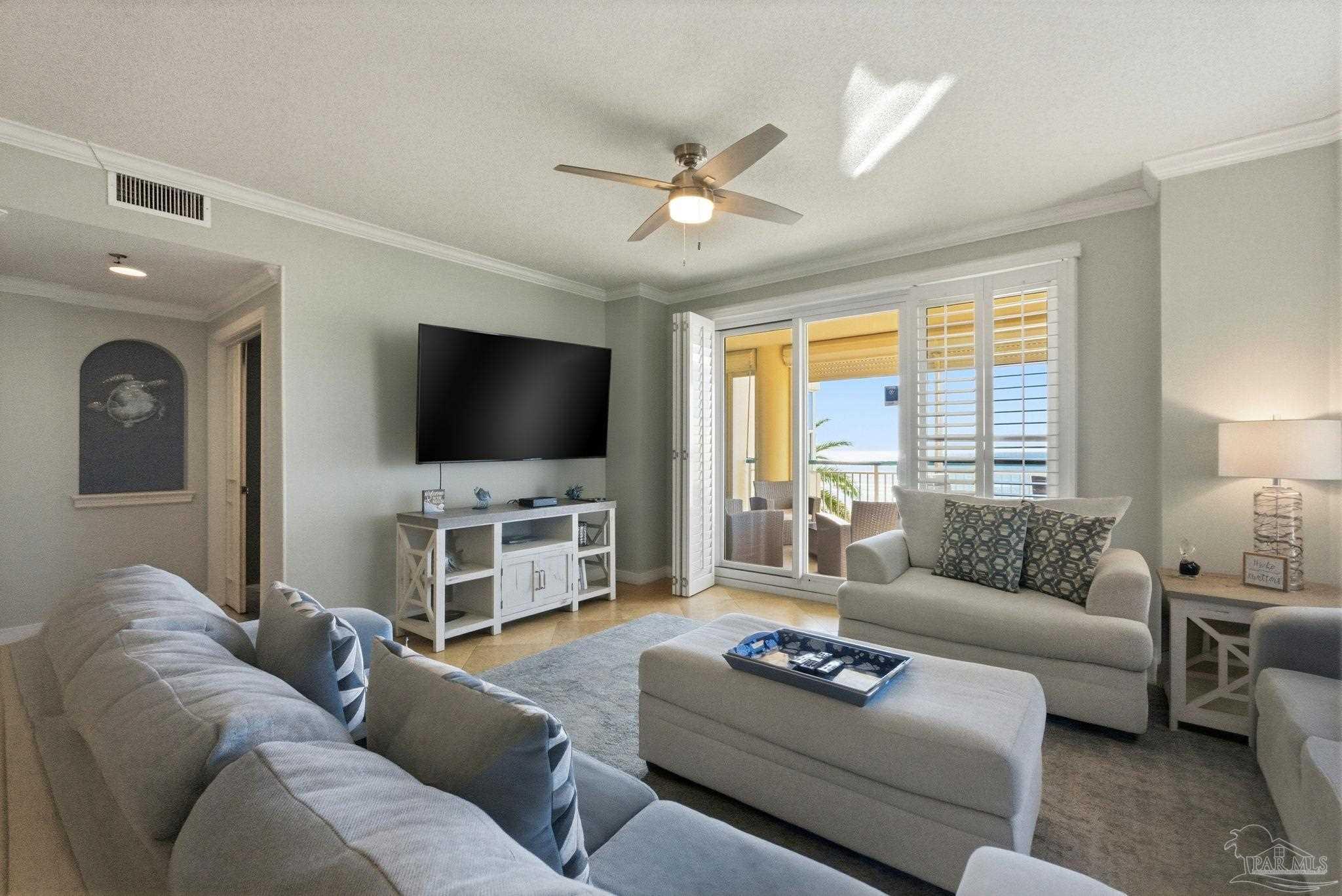 13601 Perdido Key Drive, Unit W2C Perdido Key, FL 32507 - Photo 15 of 63 a living room with furniture and a flat screen tv