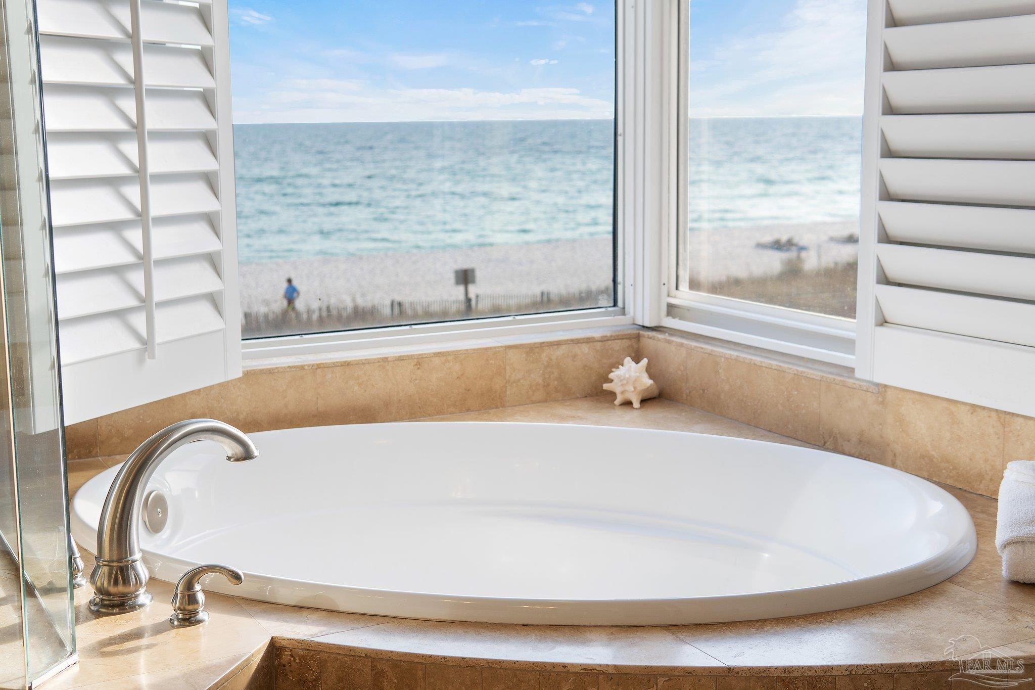 13601 Perdido Key Drive, Unit W2C Perdido Key, FL 32507 - Photo 40 of 63 a bath tub sitting in a bathroom next to a window