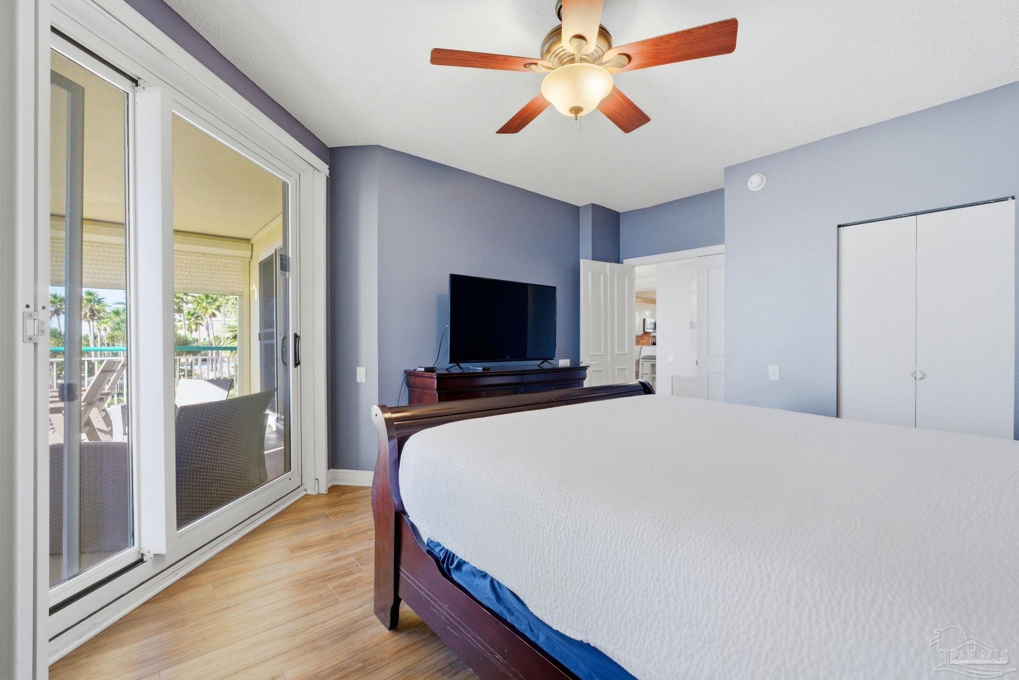 13601 Perdido Key Drive, Unit W2C Perdido Key, FL 32507 - Photo 43 of 63 a bedroom with a bed and a flat screen tv