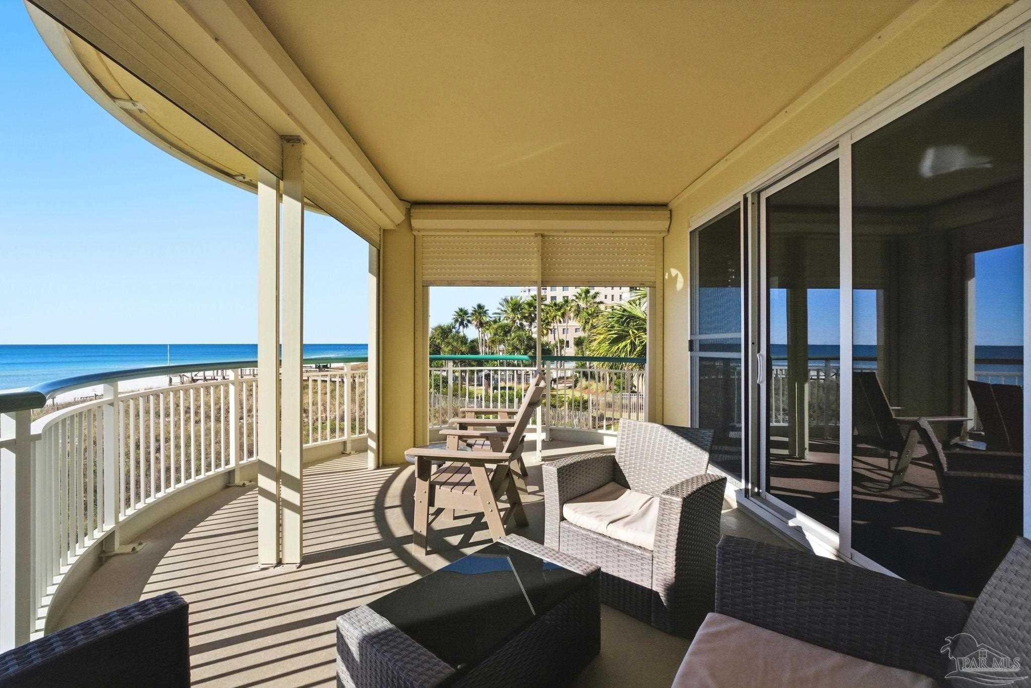 13601 Perdido Key Drive, Unit W2C Perdido Key, FL 32507 - Photo 46 of 63 a living room with furniture and floor to ceiling windows