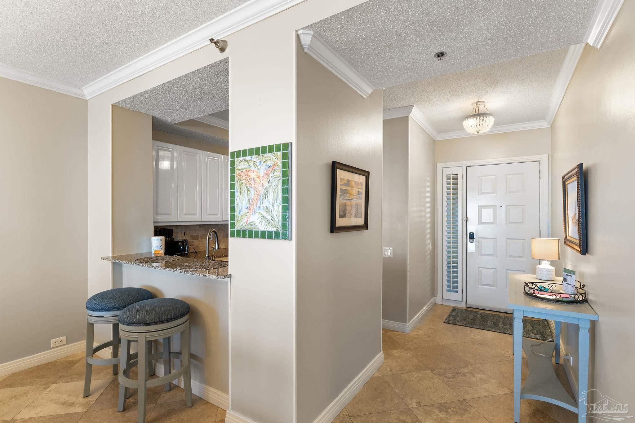 13601 Perdido Key Drive, Unit W2C Perdido Key, FL 32507 - Photo 6 of 63 a bathroom with a granite countertop sink a toilet and mirror