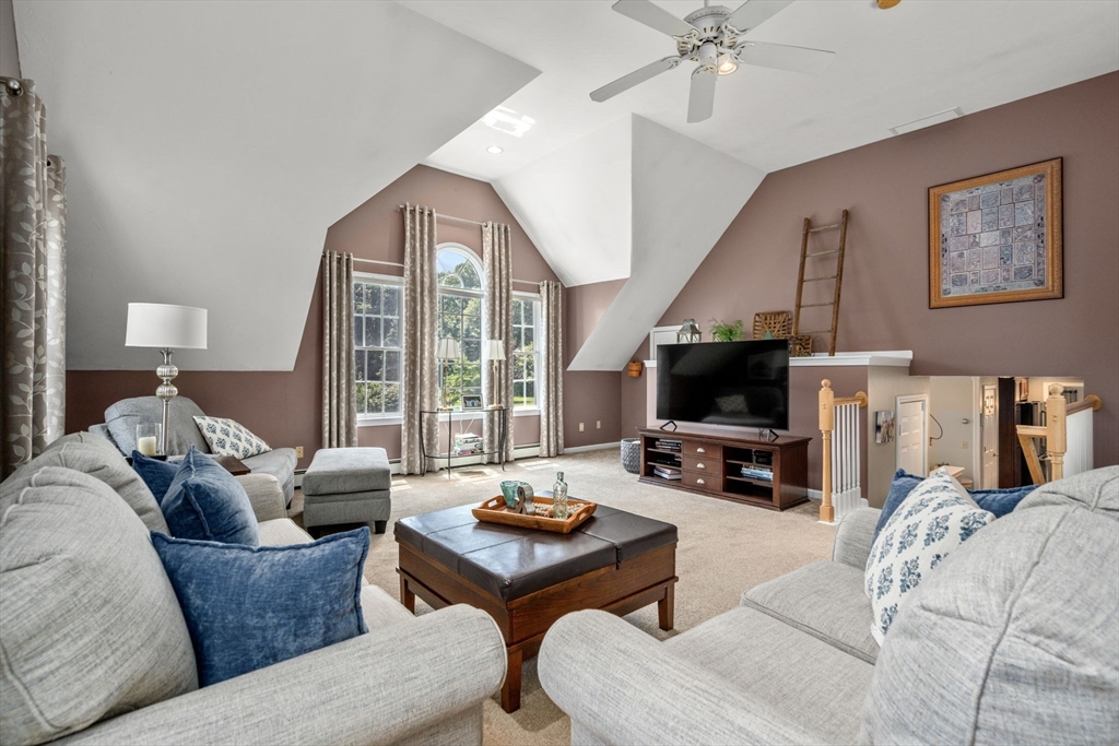 16 Jasmine Road Medway, MA 02053 - Photo 12 of 41 a living room with furniture and a flat screen tv