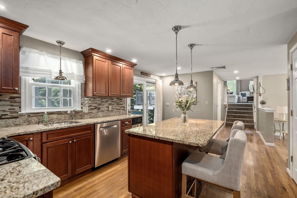 16 Jasmine Road Medway, MA 02053 - Photo 2 of 41 a kitchen with center island and stainless steel appliances