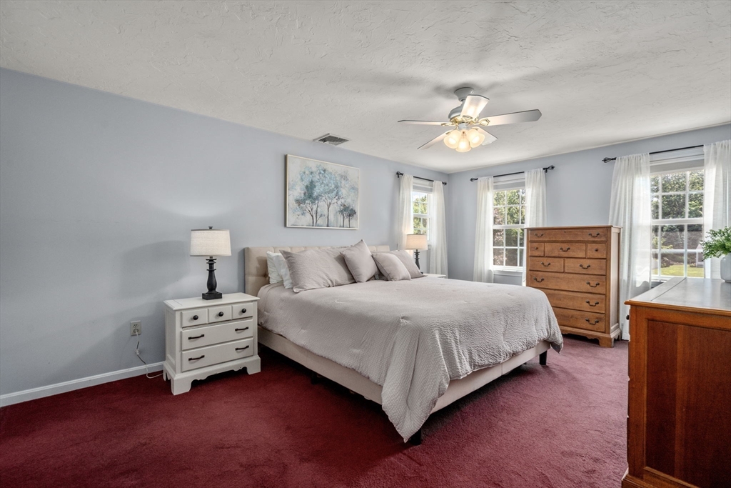 16 Jasmine Road Medway, MA 02053 - Photo 21 of 41 a bedroom with a bed and a chandelier