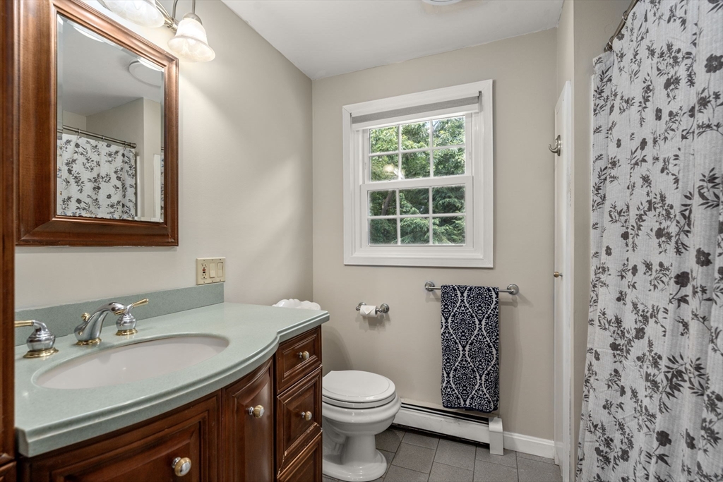 16 Jasmine Road Medway, MA 02053 - Photo 23 of 41 a bathroom with a sink toilet and vanity