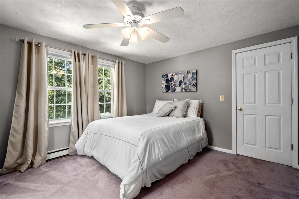16 Jasmine Road Medway, MA 02053 - Photo 27 of 41 a spacious bedroom with a large bed and a window