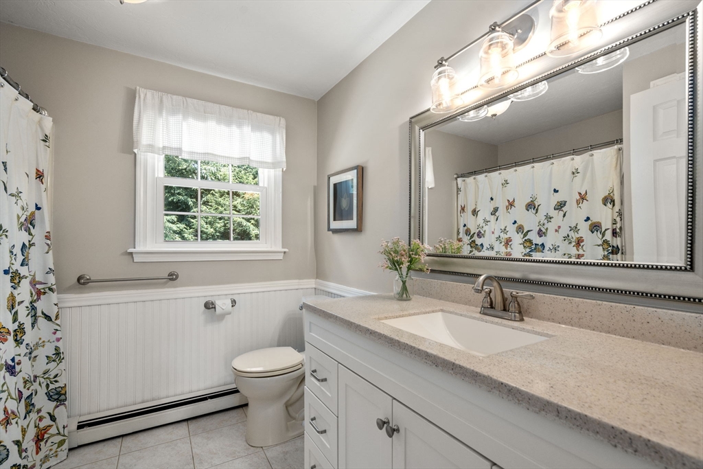 16 Jasmine Road Medway, MA 02053 - Photo 29 of 41 a bathroom with a granite countertop sink a toilet and a bathtub