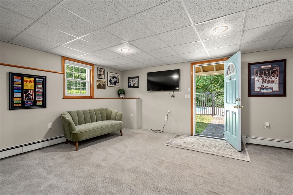 16 Jasmine Road Medway, MA 02053 - Photo 32 of 41 a living room with furniture and a flat screen tv