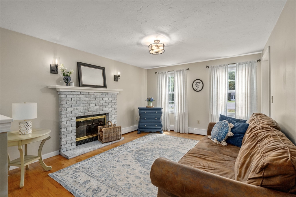 16 Jasmine Road Medway, MA 02053 - Photo 7 of 41 a bedroom with a bed and a fireplace