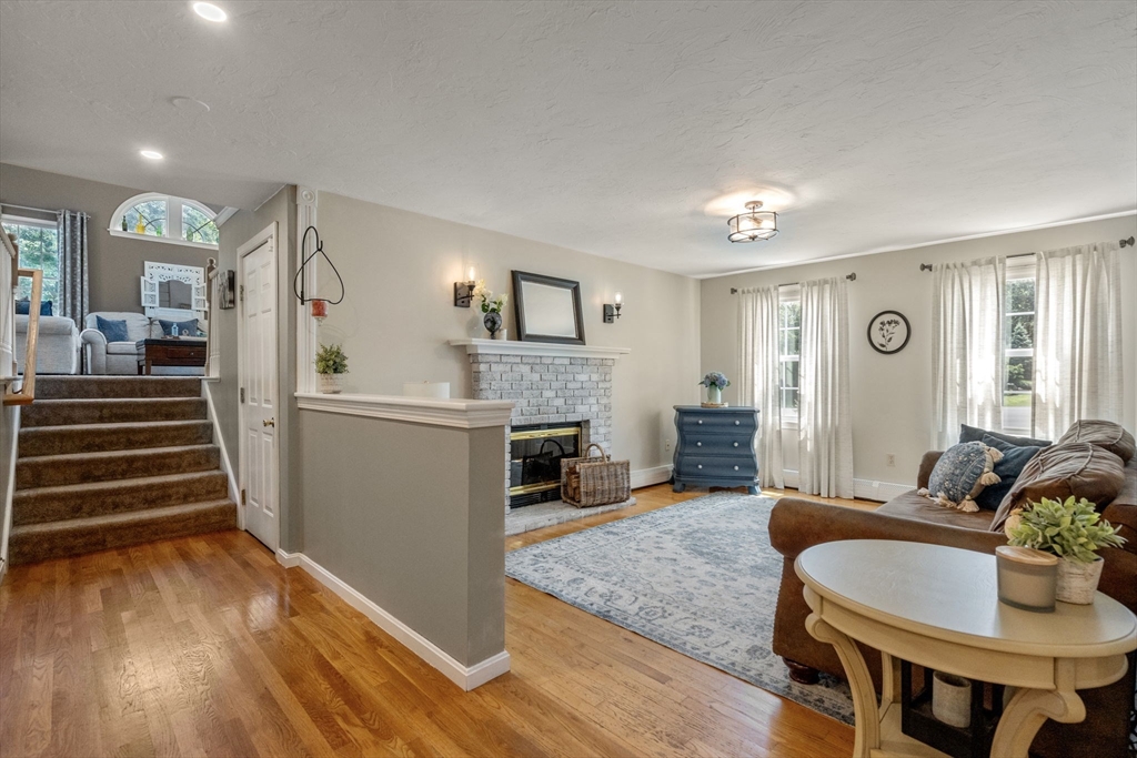 16 Jasmine Road Medway, MA 02053 - Photo 9 of 41 a living room with furniture and a fireplace