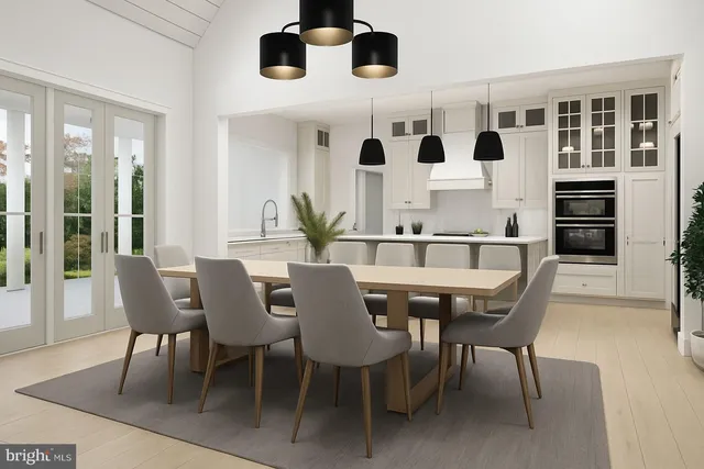 a view of a dining room with furniture and chandelier