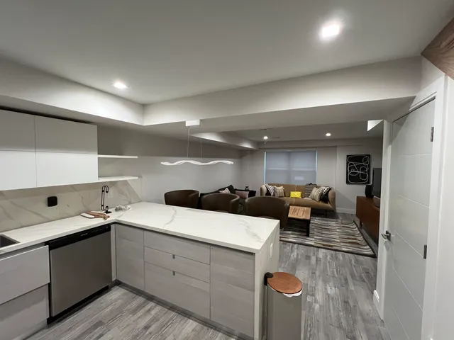 a living room with furniture and a rug