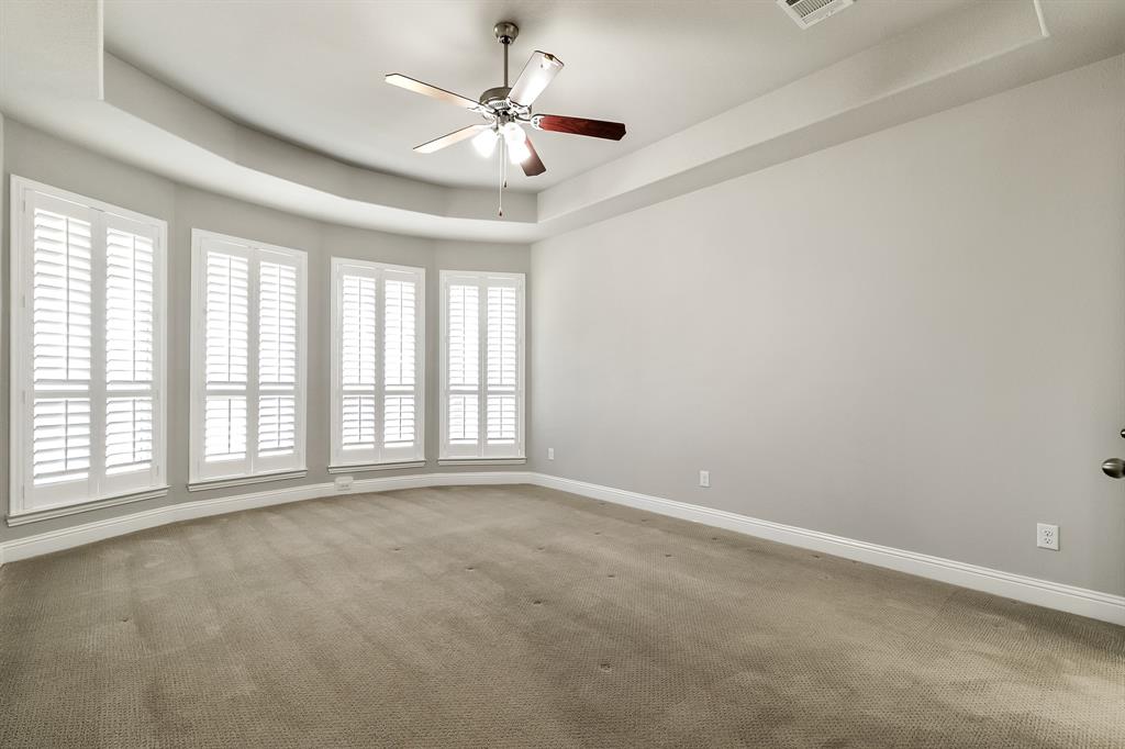 2936 Prescott The Colony, TX 75056 - Photo 11 of 28 an empty room with chandelier fan and windows