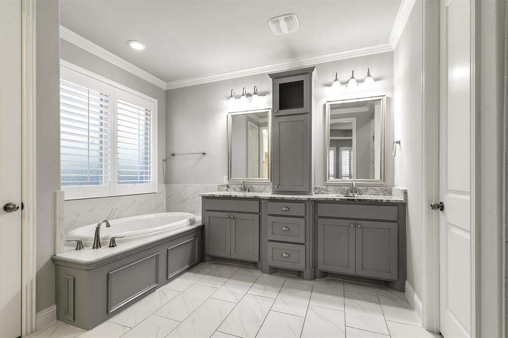 2936 Prescott The Colony, TX 75056 - Photo 12 of 28 a bathroom with a granite countertop sink a toilet a mirror and bathtub