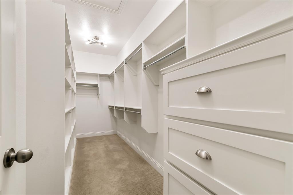 2936 Prescott The Colony, TX 75056 - Photo 15 of 28 a view of walk in closet with empty racks