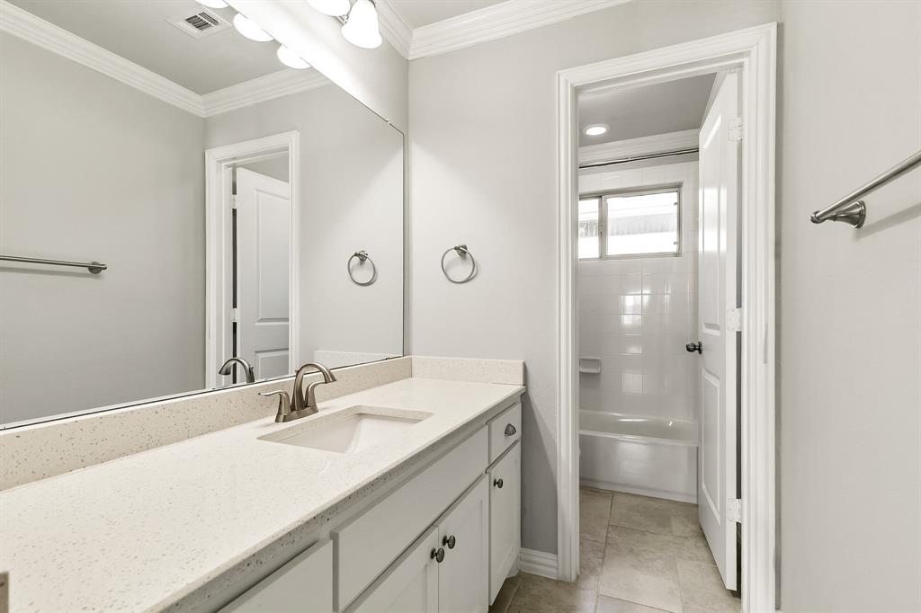 2936 Prescott The Colony, TX 75056 - Photo 21 of 28 a bathroom with a sink vanity granite and a mirror
