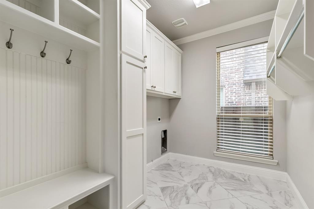 2936 Prescott The Colony, TX 75056 - Photo 25 of 28 a view of a kitchen with white cabinets and a window