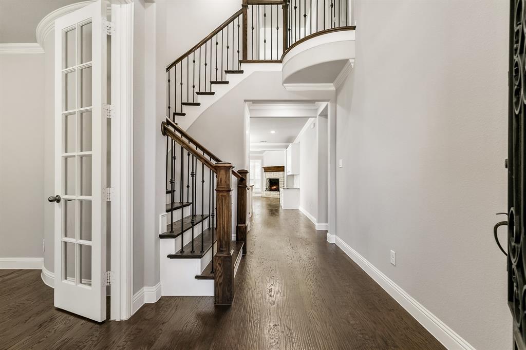 2936 Prescott The Colony, TX 75056 - Photo 3 of 28 a view of a hallway with wooden floor and staircase