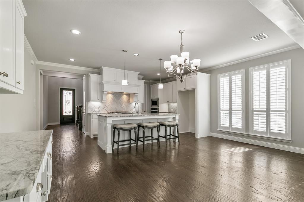 2936 Prescott The Colony, TX 75056 - Photo 9 of 28 a view of a dining room with furniture window and wooden floor
