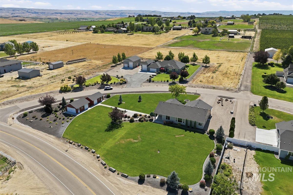 13496 Hockberger Ranch Road Caldwell, ID 83607 - Photo 36 of 40 Expansive property featuring a single-story residence, detached garage, and a large, manicured lawn