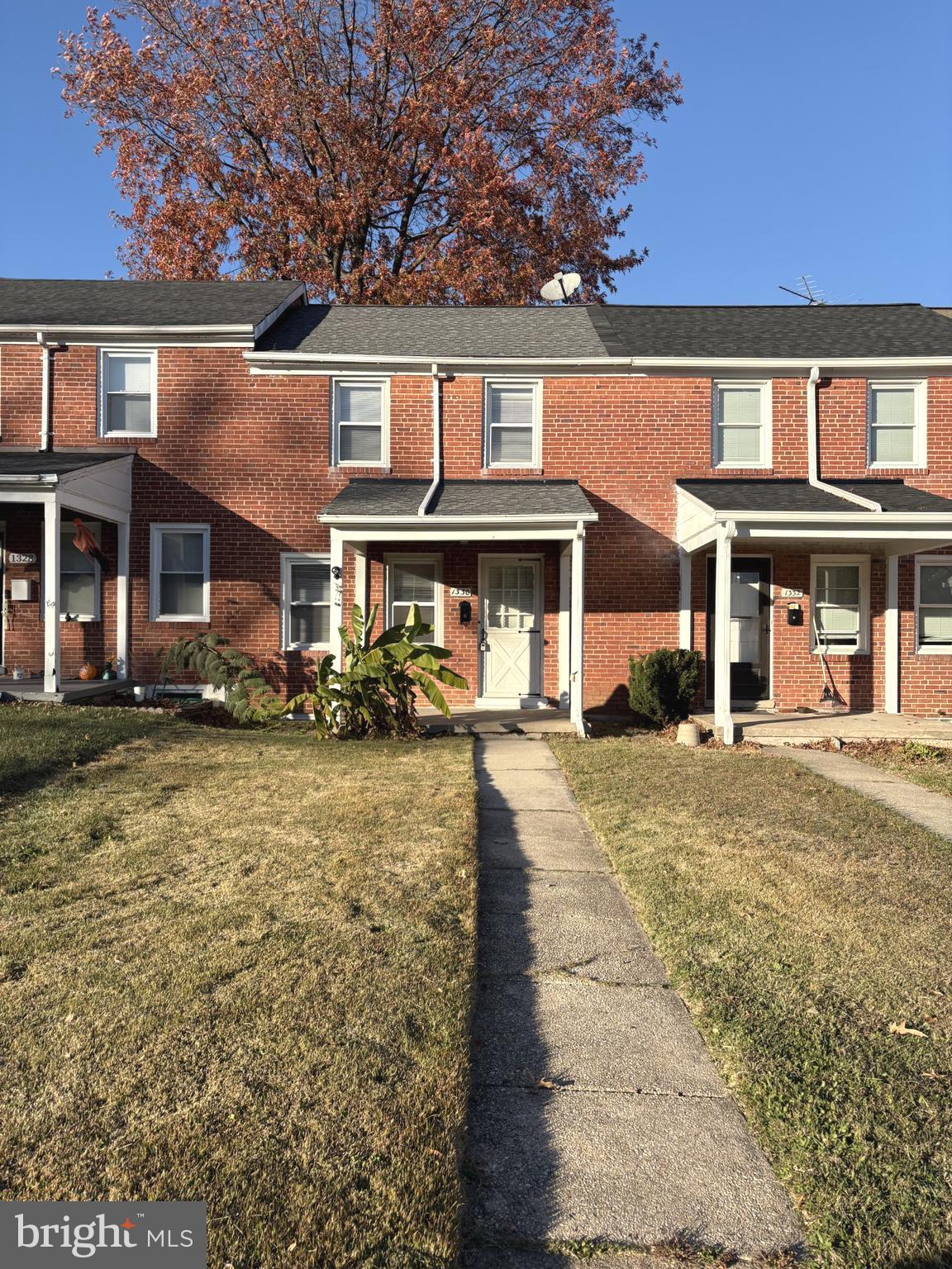 1330 Meridene Drive Baltimore, MD 21239 - Photo 1 of 15 a front view of a house with garden