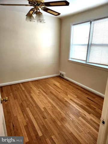 a view of an empty room and a window