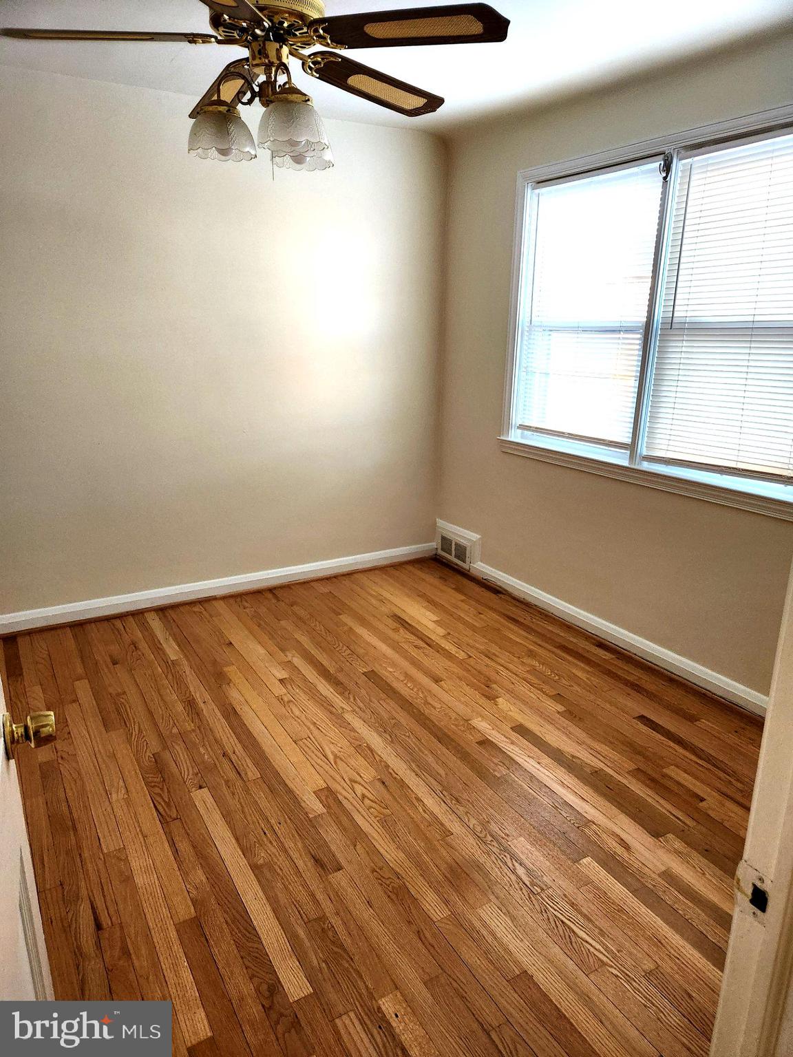1330 Meridene Drive Baltimore, MD 21239 - Photo 12 of 15 a view of a room with wooden floor and cabinet