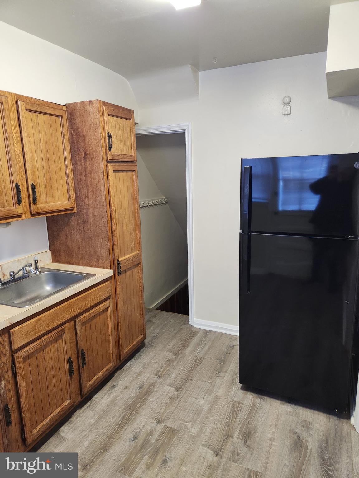 1330 Meridene Drive Baltimore, MD 21239 - Photo 10 of 15 a kitchen with stainless steel appliances granite countertop a refrigerator and a stove