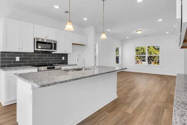 a bathroom with a sink and a window