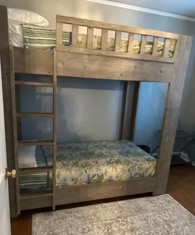a bedroom with a bed and a dresser