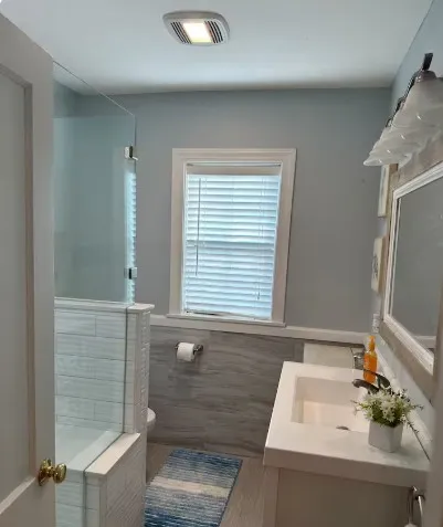 a bathroom with a sink and a mirror