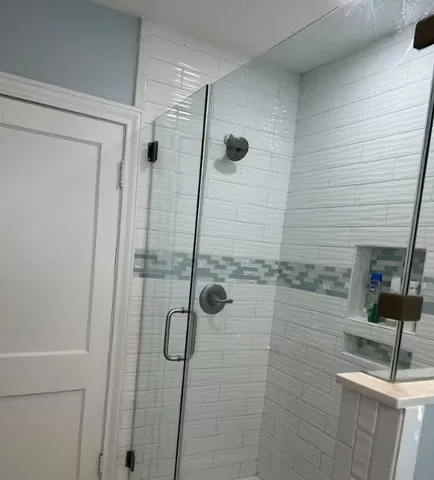 a bathroom with a shower and a sink