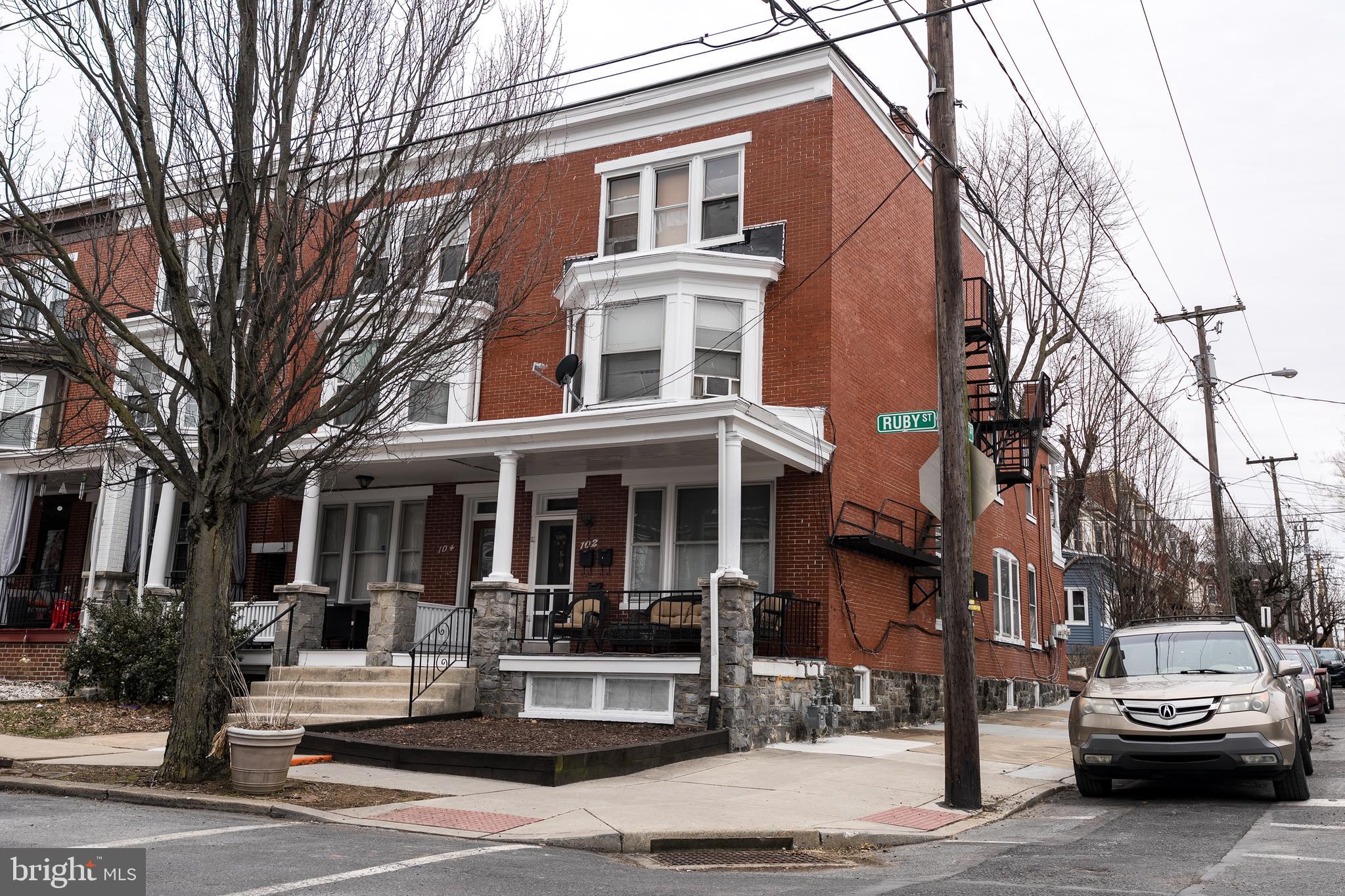 102 Ruby Street Lancaster, PA 17603 - Photo 2 of 41 a view of a white apartments with large windows
