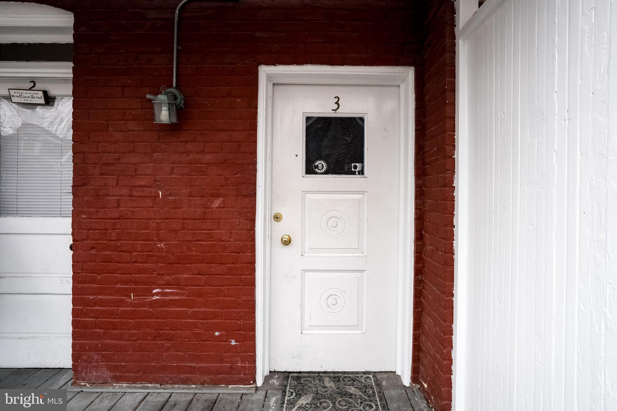 102 Ruby Street Lancaster, PA 17603 - Photo 24 of 41 a view of a hallway with wooden floor and staircase