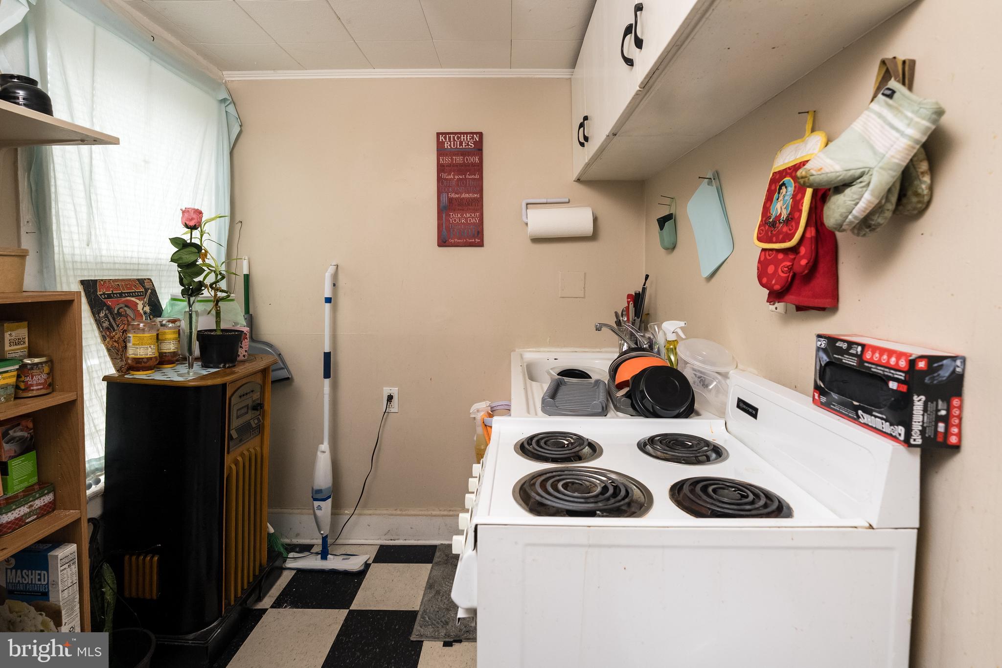 102 Ruby Street Lancaster, PA 17603 - Photo 26 of 41 a bathroom with a sink a stove and a refrigerator