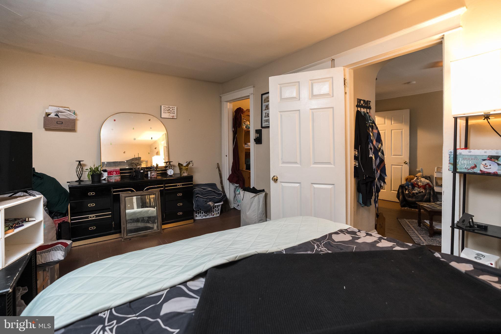 102 Ruby Street Lancaster, PA 17603 - Photo 28 of 41 a bedroom with a bed and a flat tv screen on dresser