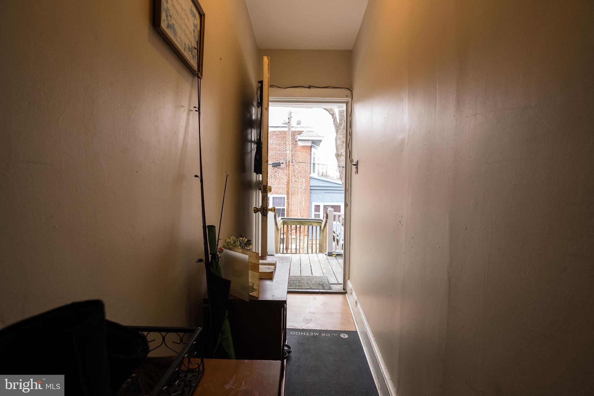 102 Ruby Street Lancaster, PA 17603 - Photo 34 of 41 a view of a hallway with wooden floor and a bathroom