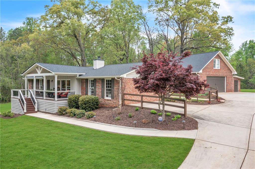 2237 Batesville Road Canton, GA 30115 - Photo 1 of 1 a front view of house with yard and green space