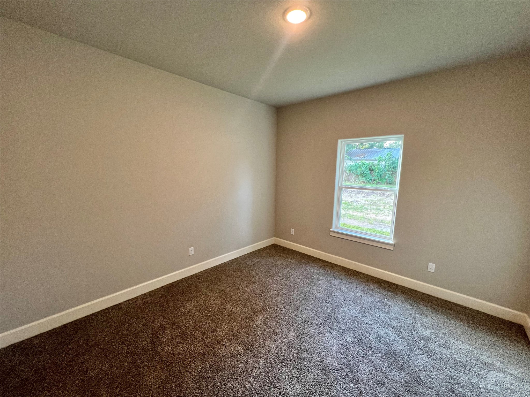 1007 South Anderson Street Angleton, TX 77515 - Photo 11 of 18 an empty room with a window