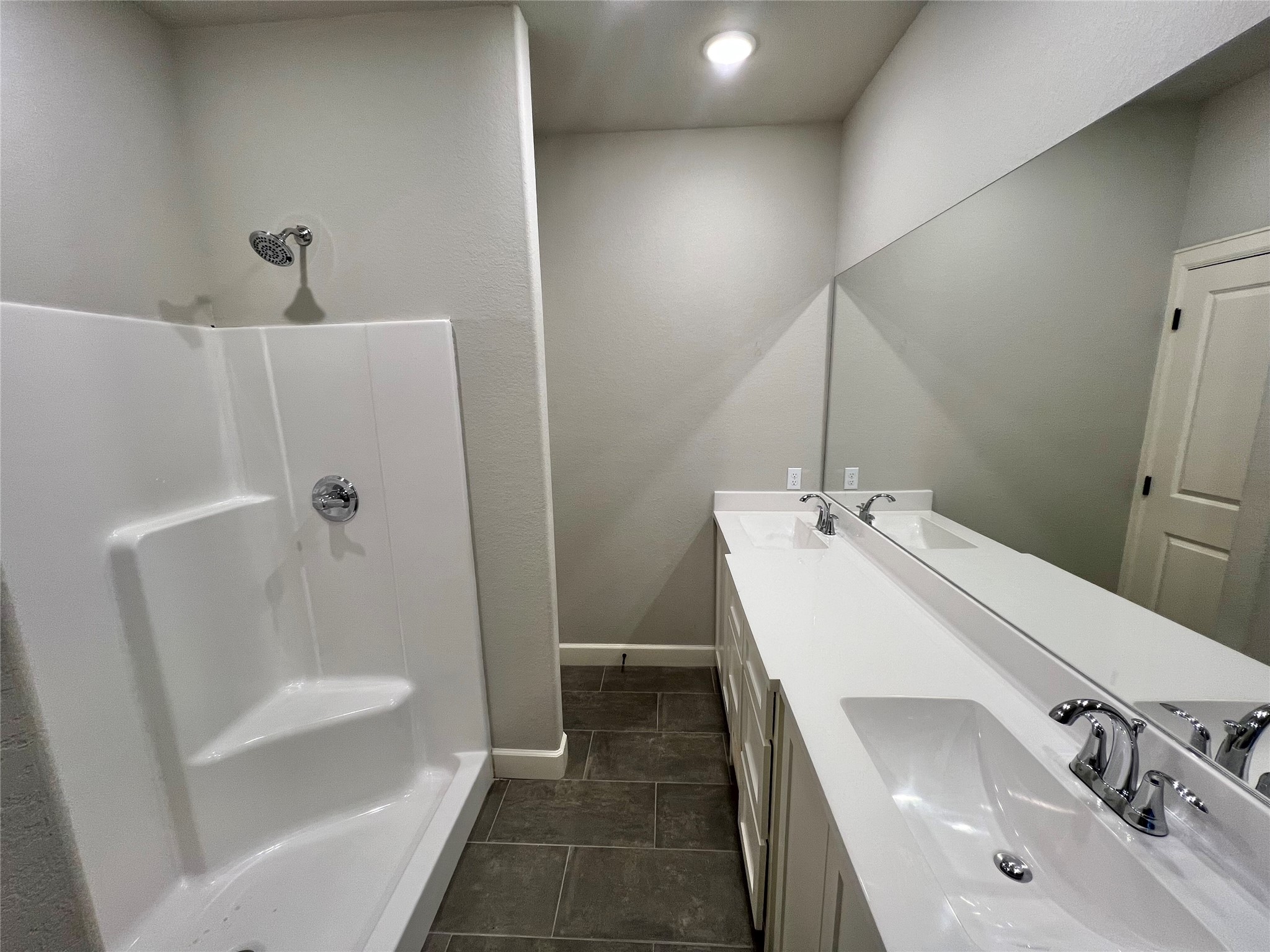 1007 South Anderson Street Angleton, TX 77515 - Photo 15 of 18 a bathroom with a sink a tub and shower